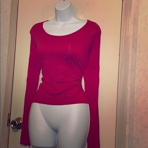 Red long sleeve blouse with black stone accents